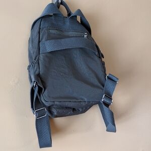 Grey Backpack w/ inside pocket and strap for luggage
